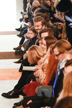 Harper sits front row at her mother's NYFW show alongside Vogue editor-in-chief Anna Wintour.