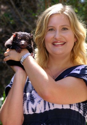 Geneticist Kathy Belov with a devil pup.