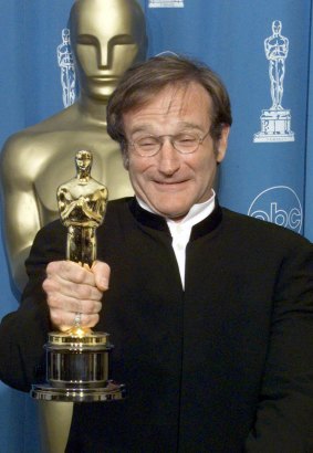 Crowning achievement: Williams with his Oscar for Good Will Hunting.