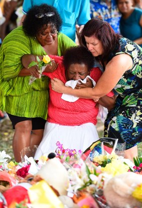 Loved ones mourn the loss of eight children in Cairns.
