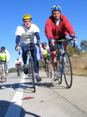 Steve Hodge rides into the NSW town of Gunning with then health minister Tony Abbott during the 2004 Pollie Pedal.