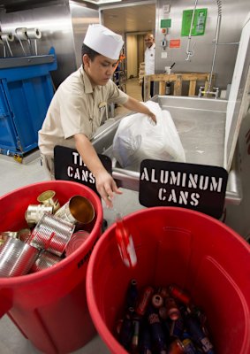 Crew on Harmony of the Seas separate recyclables.