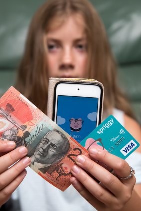 Danika Klinkenberg gets her pocket money paid straight into a credit card linked with an app. 