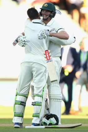 Peter Handscomb of Australia and Matthew Renshaw of Australia celebrate winning the match during day four of the Third Test match between Australia and South Africa.