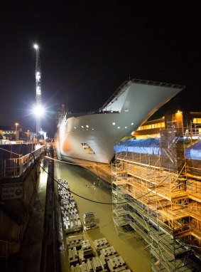 HMAS Adelaide enters the dry dock for examination.