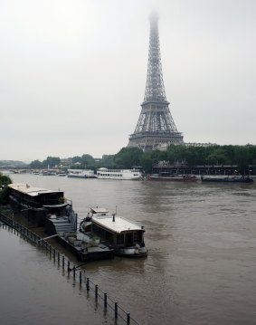 Barges are parked on the overflowing embankments as the water level has risen 4.3 metres higher than usual. 