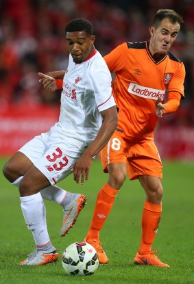 Brisbane Roar midfielder Steven Lustica (right) competes for the ball against Liverpool's Jordan Ibe in last Friday's friendly at Suncorp Stadium.
