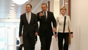 Environment Minister Greg Hunt, Prime Minister Tony Abbot and Foreign Affairs Minister Julie Bishop at Parliament House. 