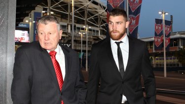 Dragons fullback Josh Dugan, right, arrives at a judiciary hearing on July 29, 2015 for an unrelated matter.
