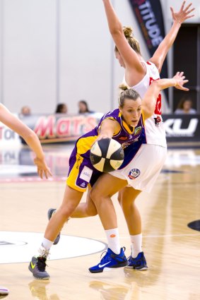 Melbourne Boomers' guard Maddie Garrick is fouled by Adelaide's Kayla Standish. 