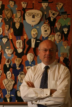 Arts Minister Senator George Brandis in the entrance to his Parliamentary offices in Canberra. The Opposition has accused Senator Brandis of seeking a 'private arts fiefdom'.