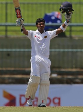 Ton up: Kusal Mendis celebrates scoring his maiden Test century on day three of the first Test. 