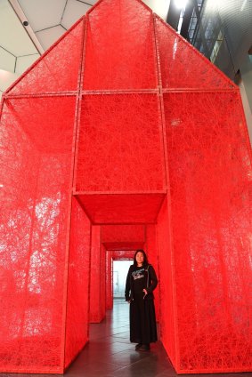 Chiharu Shiota with her Melbourne Festival installation <i>The Home Within</i>.