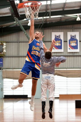 Jockey Larry Cassidy was paired up against Brisbane Bullets player Mitch Young.