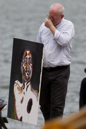 Lawyer Julian McMahon carries a self-portrait painted by Australian death row prisoner Myuran Sukumaran.