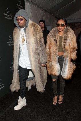 Chris Brown (L) and Karrueche Tran are seen during Mercedes-Benz Fashion Week Fall 2015 at Lincoln Center for the Performing Arts on February 17, 2015 in New York City.