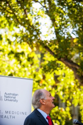 Professor Alan Alda, competes with a cockatoo during his speech at the official opening of the Alan Alda Centre at The Australian National Centre for the Public Awareness of Science (CPAS) at the ANU.