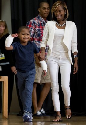 Zion Harvey arrives to a news conference with his mother Pattie Ray.