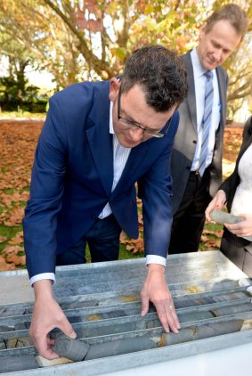 Premier Daniel Andrews and Evan Tattersall, chief of the Melbourne Metro Rail Authority, inspect the results of geo-technical drilling work for the Melbourne Metro rail project at gardens on St Kilda Road.