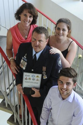 Station Sergeant Rodney Anderson was one of five recipients of the ACT Community Protection Medal. He is pictured with his wife, Donna and children, Ashlea, 20 and Will, 17.  