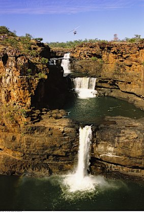 Helicopter hovering over Mitchell Falls.