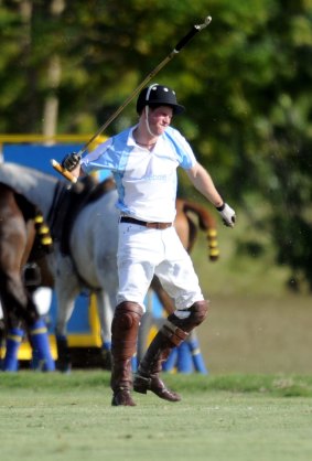 Prince Harry shows his frustration after he falling from his horse in Barbados.