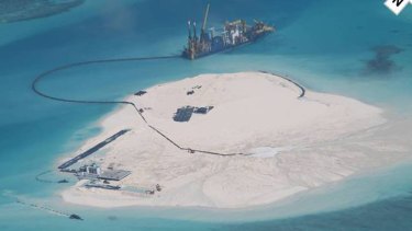 A Chinese vessel, top centre, in the Spratly Islands in the South China Sea, in this photo taken by a Philippines surveillance plane last year. 
