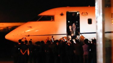 Malaysians stranded in Pyongyang arrive at Kuala Lumpur International airport last month as part of the deal to return Kim Jong-nam's body.