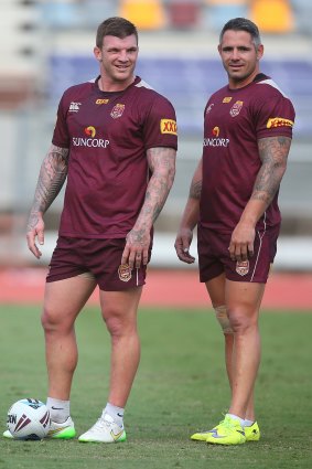 Josh McGuire and Corey Parker look on during a Queensland Maroons State of Origin training session at Queensland Sport and Athletics Centre.