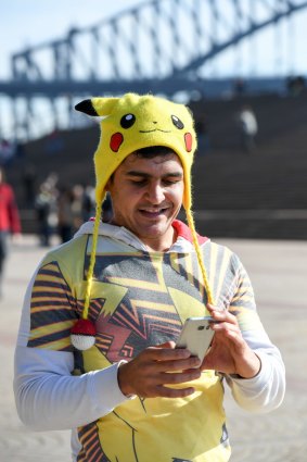 A participant on an organised Pokemon Go walk in Sydney.