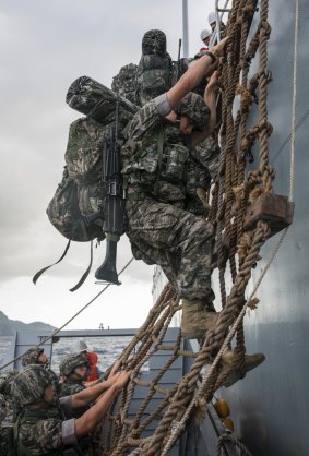 South Korean Marines disembark from a landing ship tank near Ulleung Island. More than 90 Marines are participating in the month-long drills that kicked off on Friday.