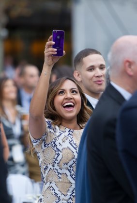 Jessica Mauboy takes a picture.