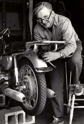 This 1975 image released by William Morrow shows author Robert M. Pirsig working on a motorcycle. 