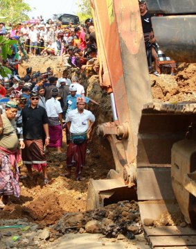 The exhumation of the bodies of nine communists from a mass grave in Batuagung village in Bali on Thursday.