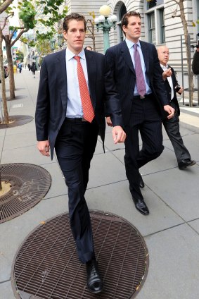 Cameron Winklevoss, left, and his twin Tyler leave a federal appeals court in San Francisco, California, US, in Janyary 2011. Facebook's settlement of claims that its founder Mark Zuckerberg stole the idea for what became the world's largest social-networking website should be undone, the former college classmates of Mr Zuckerberg told an appeals court. 