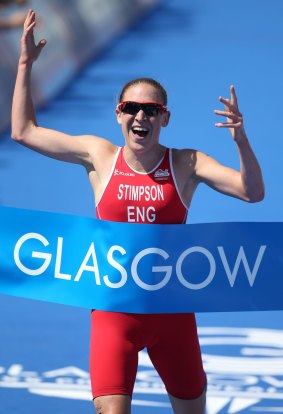 Victory at last: Jodie Stimpson celebrates crossing the finish line.