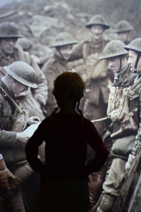 A child studies an image of World War I soldiers at the Imperial War Museum in London.