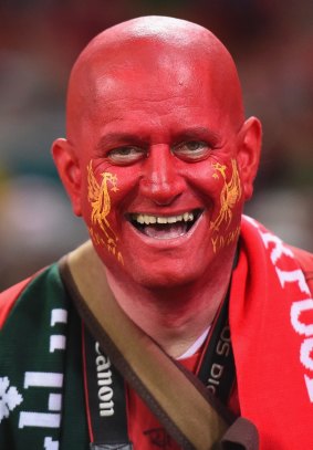 A Liverpool fan goes full face paint for the Suncorp Stadium match against the Roar.