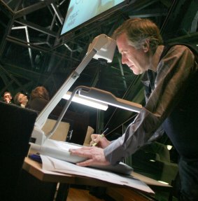Master at work: Ron Tandberg doing his cartoons to a live audience at BMW Edge for <i>The Age</i> Conversation Series.