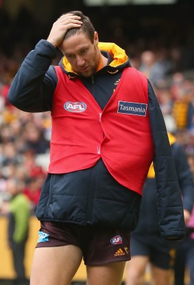 James Frawley walks around the boundary line in the sub's vest.
