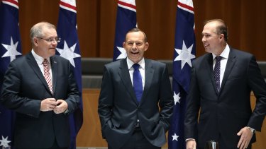 Cape York time: Social Services Minister Scott Morrison, Prime Minister Tony Abbott and Immigration Minister Peter Dutton joke while waiting for a meeting. 