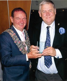 Paul Pisasale (left) presents Steve Potts with an award for diligence.