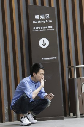 A smoking area outside an office building in Beijing. The World Health Organisation says 300 million Chinese smoke.