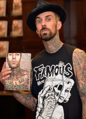 Travis Barker attends a signing of his book "Can I Say: Living Large, Cheating Death, And Drums, Drums, Drums" on October 20.