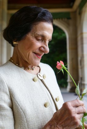 Dame Marie Bashir with the rose named in her honour, the Governor Marie Bashir, at Government House. 