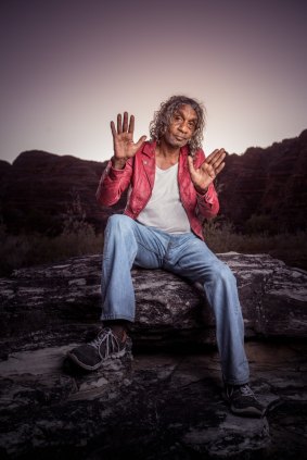 Bart Willoughby poses for a photoshoot in front of the "bee-hives" in the Bungle Bungles, Purnululu National Park. 