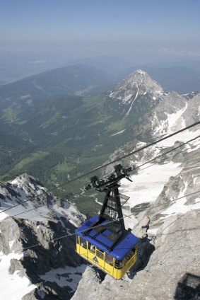 Hair-raising journey:  A jaunty yellow cable-car takes me on a single pylon-free glide up the vertiginous Dachstein.