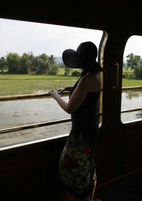 An Eastern and Oriental passenger takes in the Thai countryside.