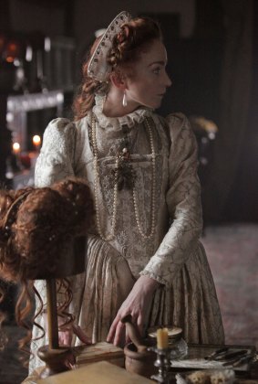 Bess Throckmorton (Phoebe Thomas) prepares Queen Elizabeth's wig in Armada: 12 Days to Save England.