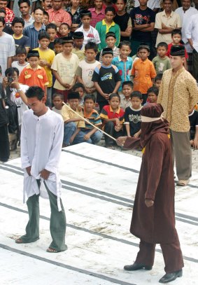Aceh is the only one of Indonesia's 34 provinces where sharia-inspired punishments are on the statute book. This man is being caned for gambling in December 2005.